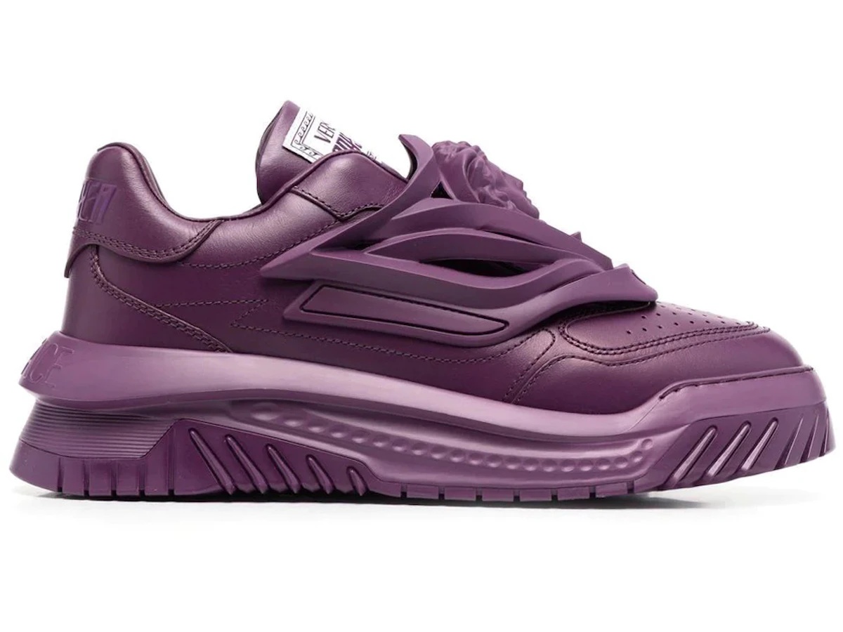 https://d2cva83hdk3bwc.cloudfront.net/1004524-1A03180_1LA60-versace-odissea-caged-rubber-medusa-sneaker-plum-purple-1.jpg