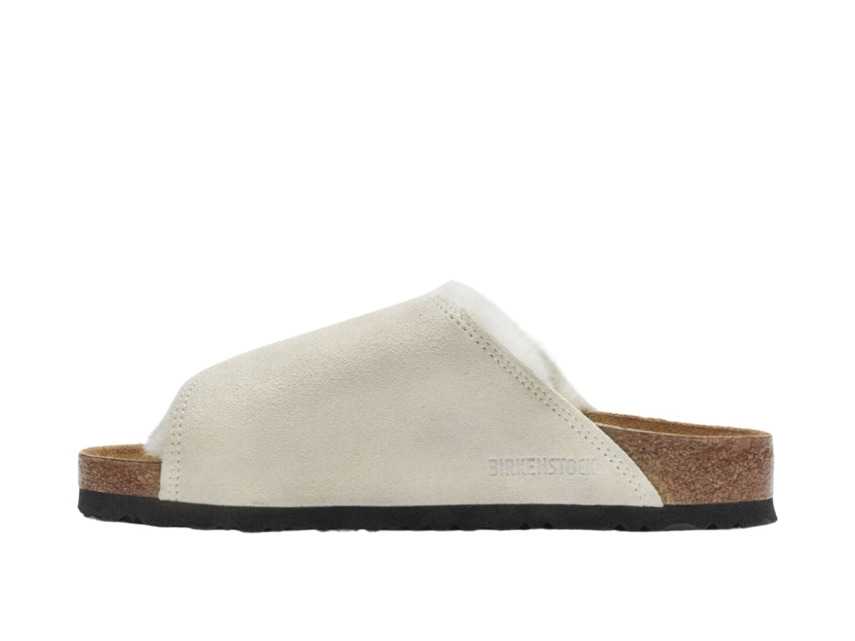 https://d2cva83hdk3bwc.cloudfront.net/1027679-st-ssy-birkenstock-solana-shearling-slide-bone-2.jpg