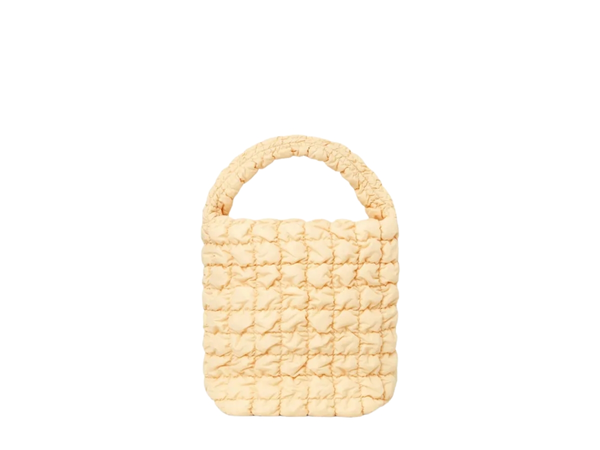 https://d2cva83hdk3bwc.cloudfront.net/1267916003-cos-quilted-mini-tote-bag-light-yellow-1.jpg