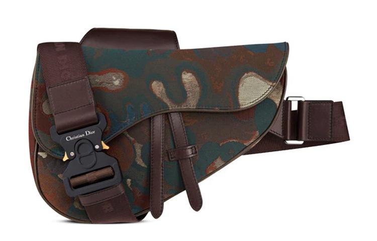 https://d2cva83hdk3bwc.cloudfront.net/1ADPO093UCM-H24E-dior-peter-doig-denim-sling-bag-men-s-camouflage-brown-1.jpg