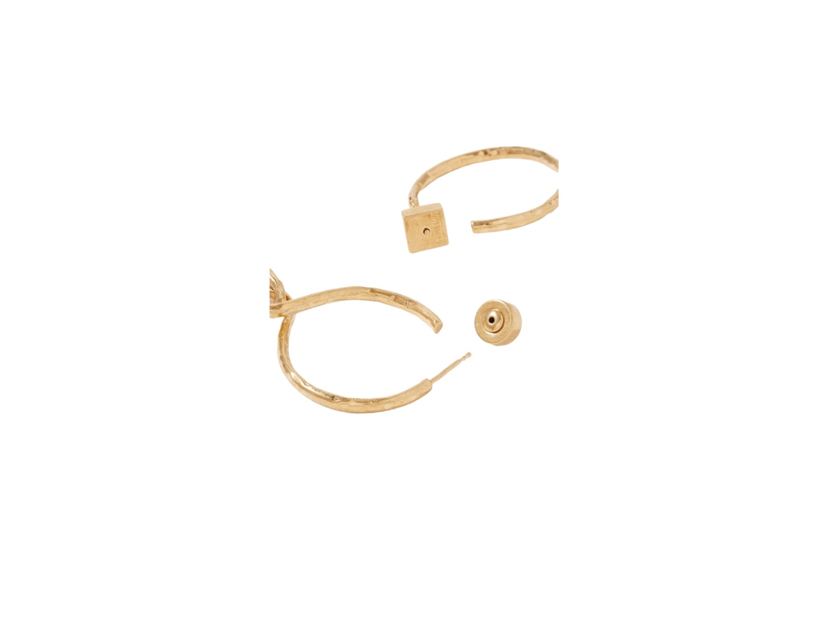 https://d2cva83hdk3bwc.cloudfront.net/22527730565879322-jacquemus-chiquita-hammered-earrings-in-gold-with-gold-tone-hardware-2.jpg