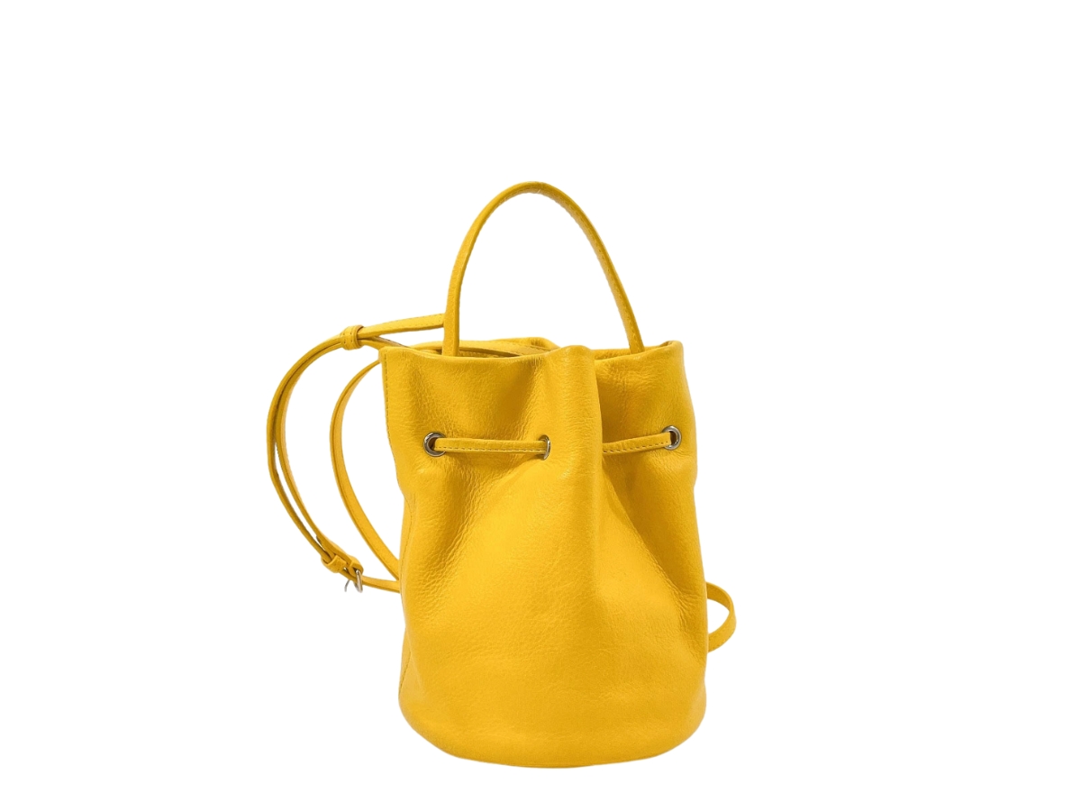 https://d2cva83hdk3bwc.cloudfront.net/638342-balenciaga-bucket-bag-yellow-2.jpg