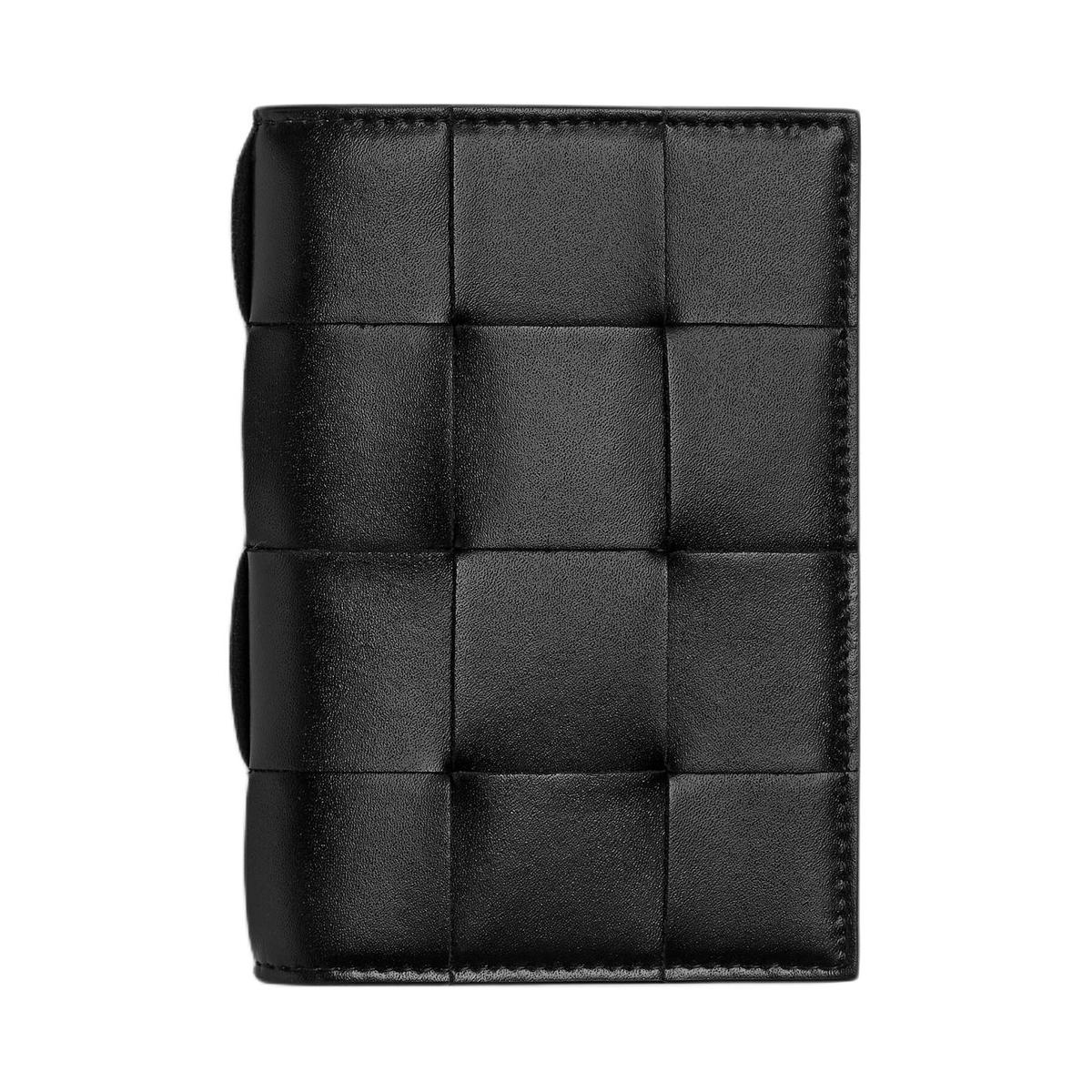 https://d2cva83hdk3bwc.cloudfront.net/789275VBWD51042-bottega-veneta-calfskin-passport-holder-men-s-black-parrot-green-1.jpg