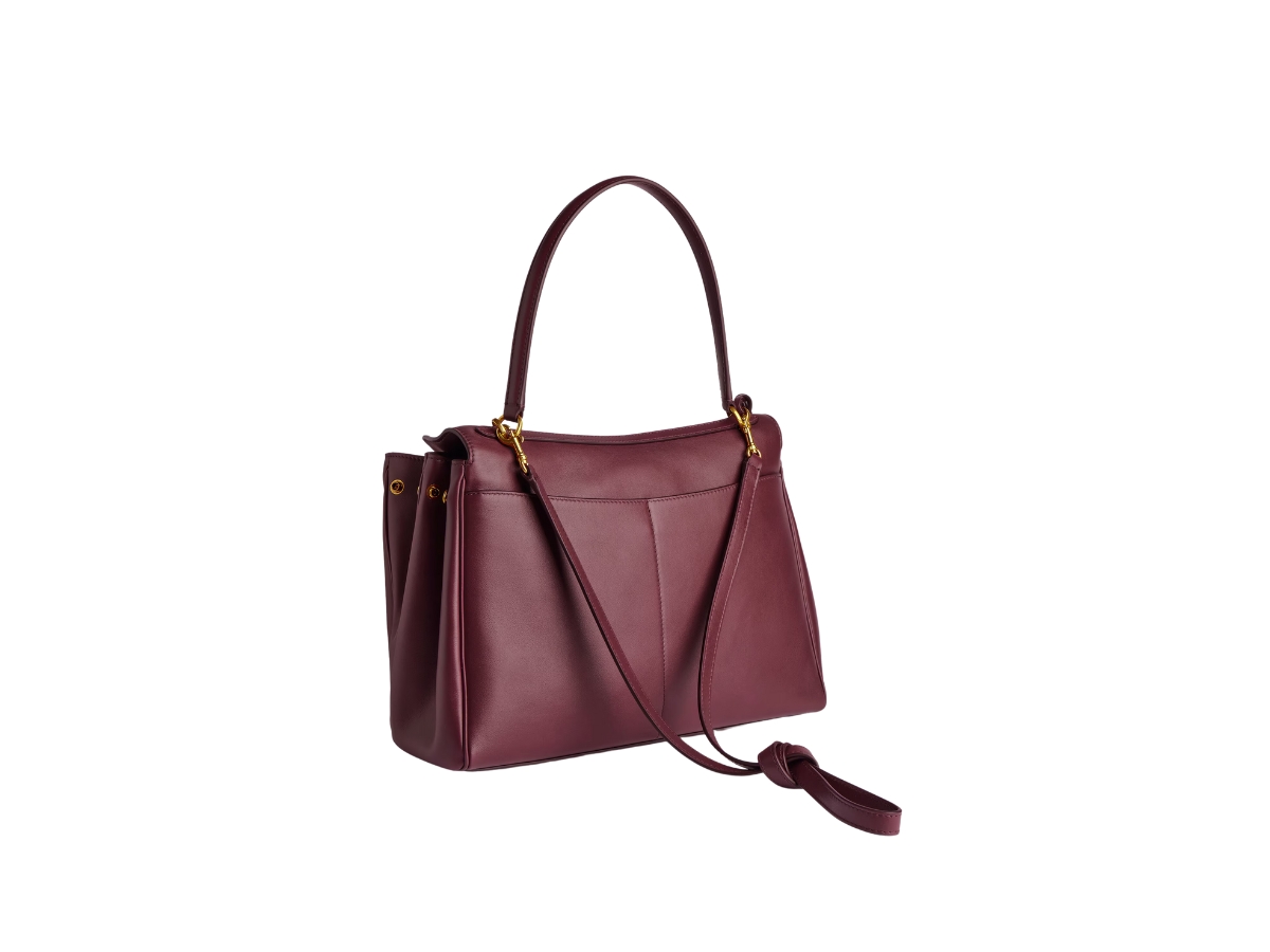 https://d2cva83hdk3bwc.cloudfront.net/7897722AA4V6034-balenciaga-rodeo-medium-handbag-in-dark-burgundy-smooth-calfskin-aged-gold-hardware-3.jpg