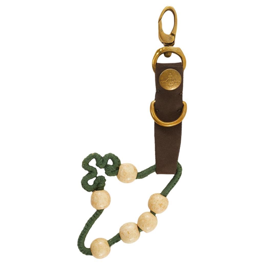 https://d2cva83hdk3bwc.cloudfront.net/8050889973829-vivienne-westwood-recycled-brass-keychains-unisex-gold-green-1.jpg