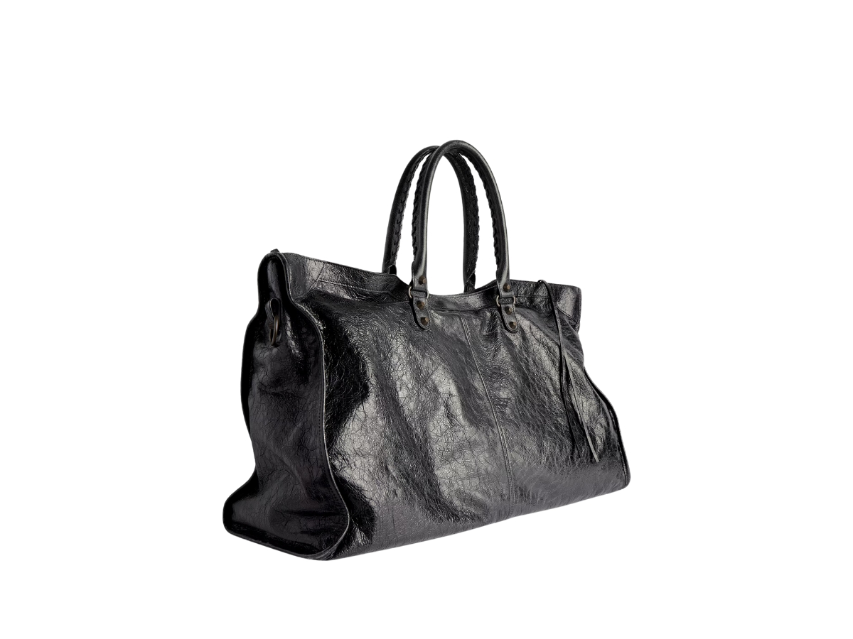 https://d2cva83hdk3bwc.cloudfront.net/8103642ABEK1000-balenciaga-le-city-travel-bag-in-black-arena-storico-lambskin-brass-hardware-2.jpg
