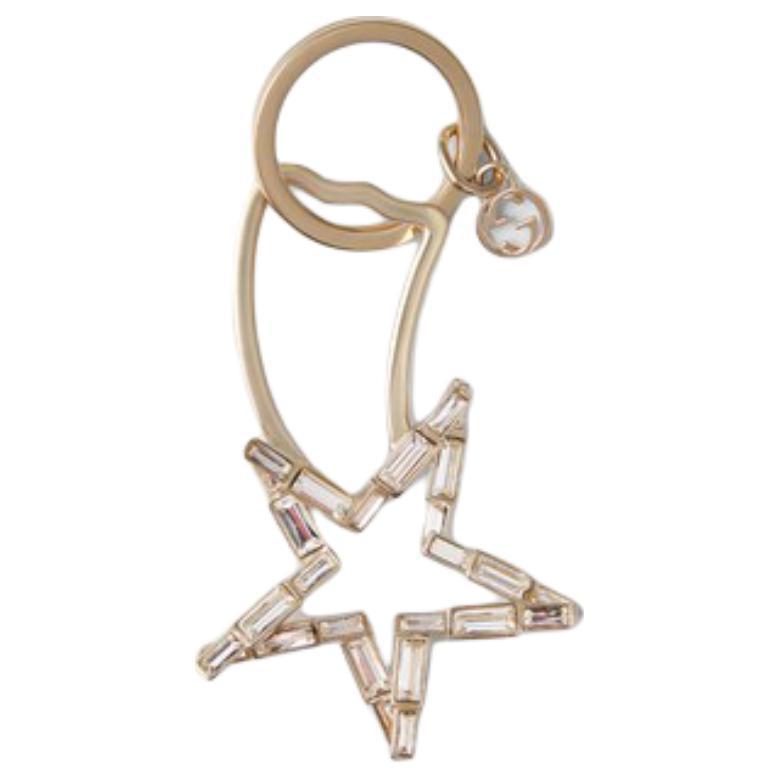 https://d2cva83hdk3bwc.cloudfront.net/812845J1D4T8576-gucci-metal-crystal-keychains-unisex-gold-1.jpg