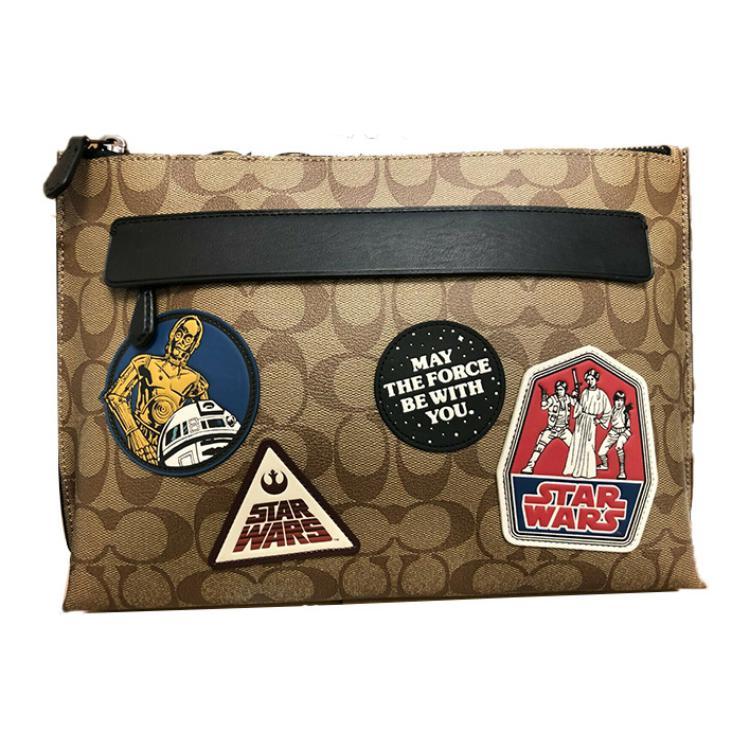 https://d2cva83hdk3bwc.cloudfront.net/88114-QBTN2-coach-star-wars-xingji-large-war-collaboration-canvas-with-leather-clutch-large-size-men-s-khaki-1.jpg