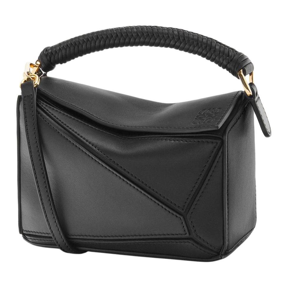 https://d2cva83hdk3bwc.cloudfront.net/A510U95X86-1100-loewe-puzzle-soft-calfskin-shoulder-bag-crossbody-bag-handbag-mini-women-s-black-1.jpg