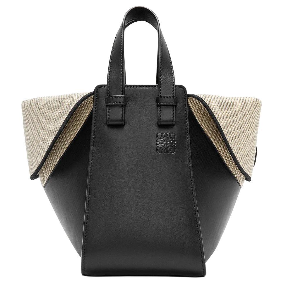 https://d2cva83hdk3bwc.cloudfront.net/A538H42X01-1100-loewe-hammock-cow-leather-with-canvas-shoulder-bag-crossbody-bag-handbag-women-s-black-1.jpg