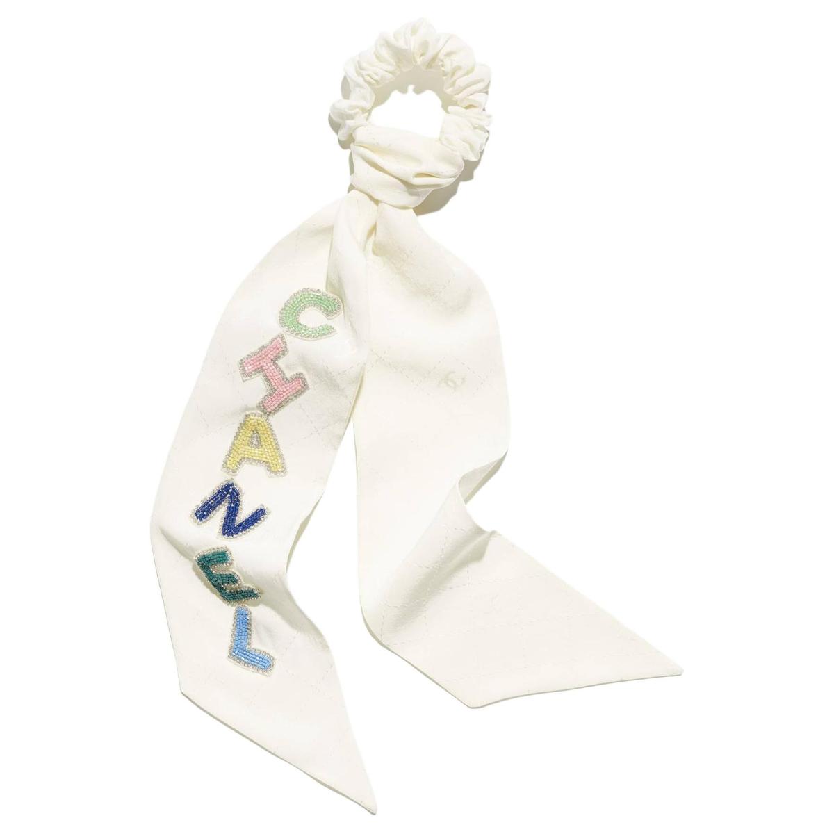 https://d2cva83hdk3bwc.cloudfront.net/AA9728B15102NT646-chanel-hair-ties-women-s-1.jpg