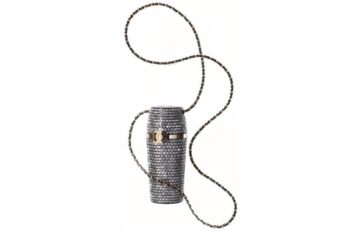 https://d2cva83hdk3bwc.cloudfront.net/AB7103-B06899-NF642-chanel-sheepskin-lipstick-with-necklace-pouch-women-s-silver-1.jpg