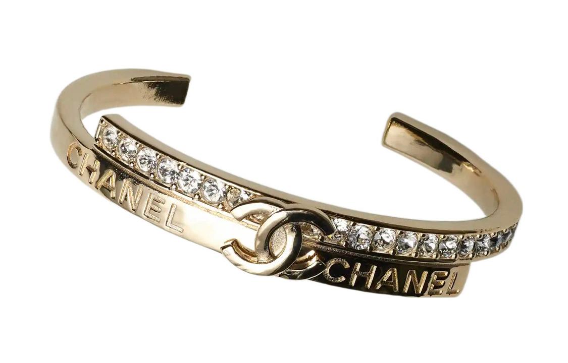 https://d2cva83hdk3bwc.cloudfront.net/AB8697-B08592-NJ195-chanel-metal-rhinestone-bangles-women-s-gold-1.jpg