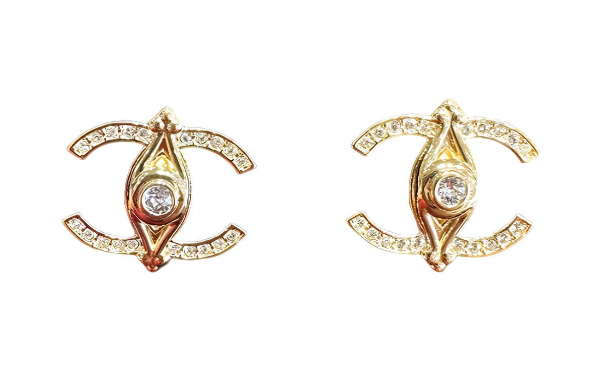 https://d2cva83hdk3bwc.cloudfront.net/ABB414-B13504-NQ018-chanel-rhinestone-stud-earrings-women-s-gold-1.jpg