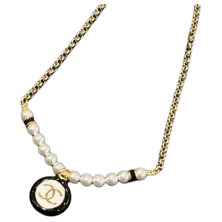 https://d2cva83hdk3bwc.cloudfront.net/ABC980-B16124-NW386-chanel-metal-artificial-pearl-necklaces-women-s-gold-1.jpg