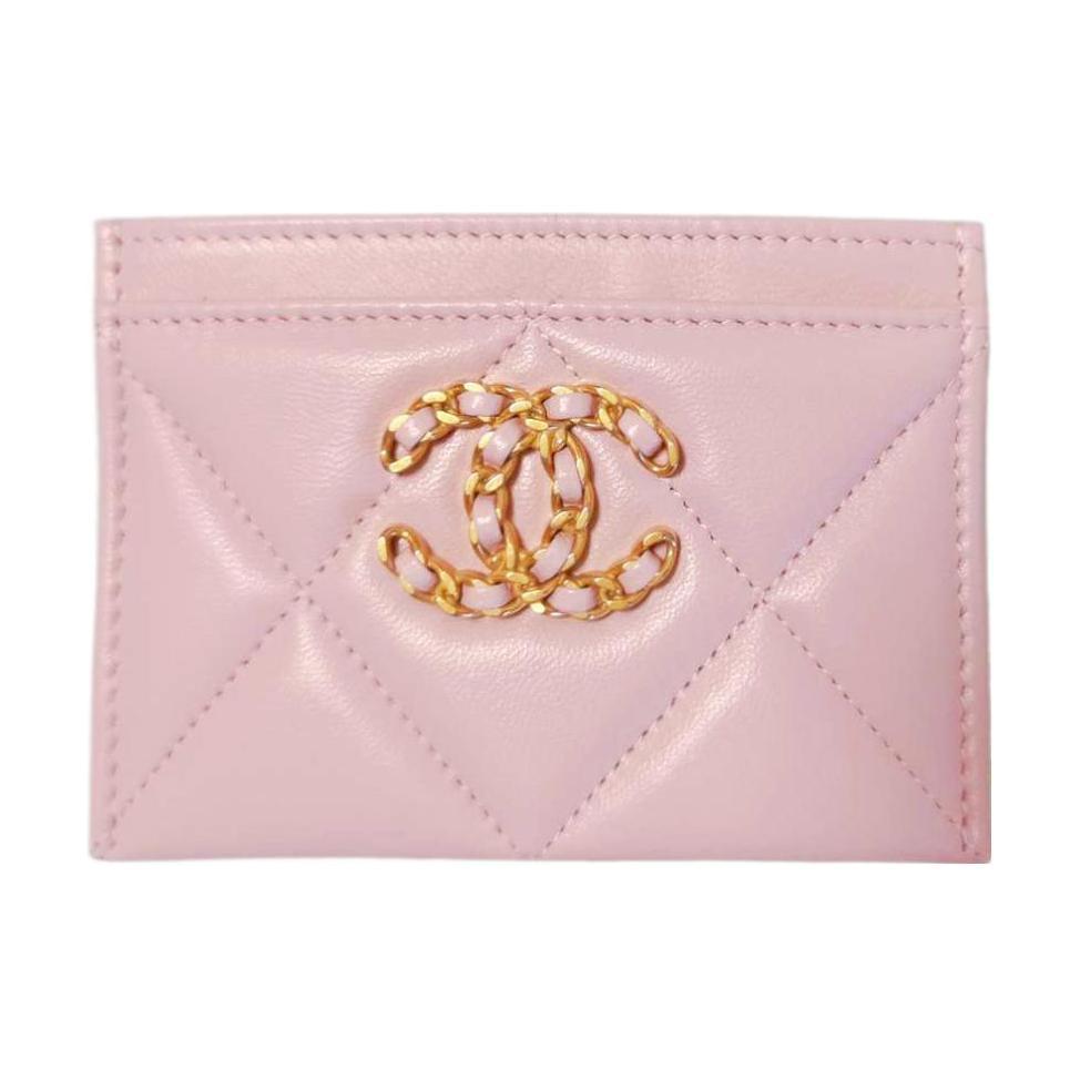 https://d2cva83hdk3bwc.cloudfront.net/AP1167-B04852-NJ523-chanel-19bag-lambskin-card-sleeve-card-holder-women-s-cherry-blossom-pink-1.jpg