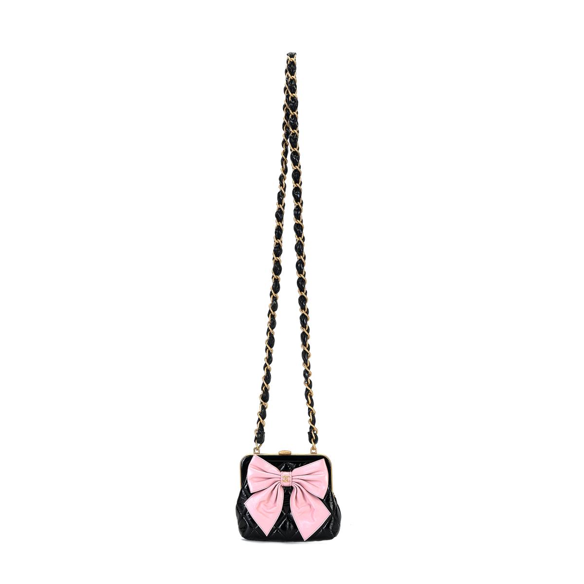 https://d2cva83hdk3bwc.cloudfront.net/AP4028-B16926-NZ950-chanel-24a-bowknot-gold-tone-metal-clutch-with-chain-black-pink-1.jpg