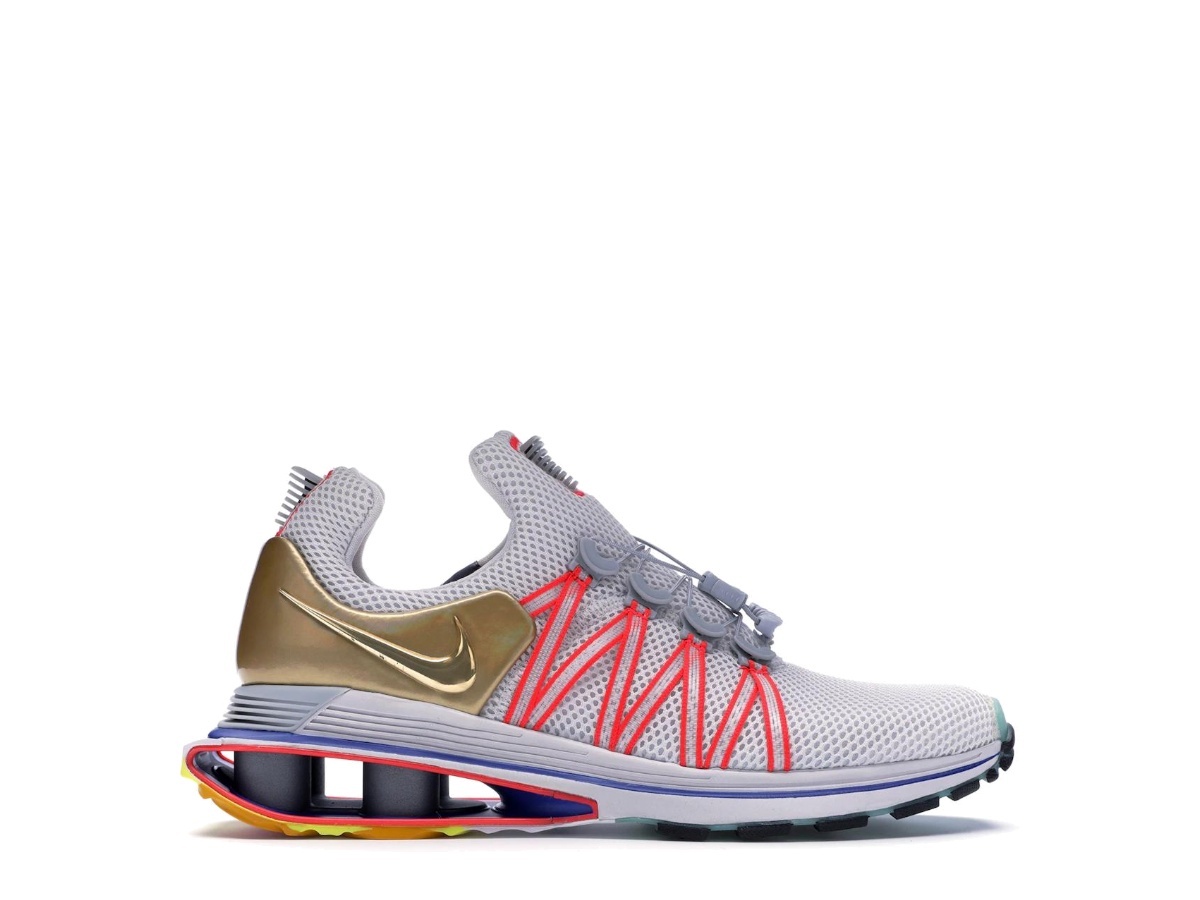 nike shox gravity vast grey metallic gold