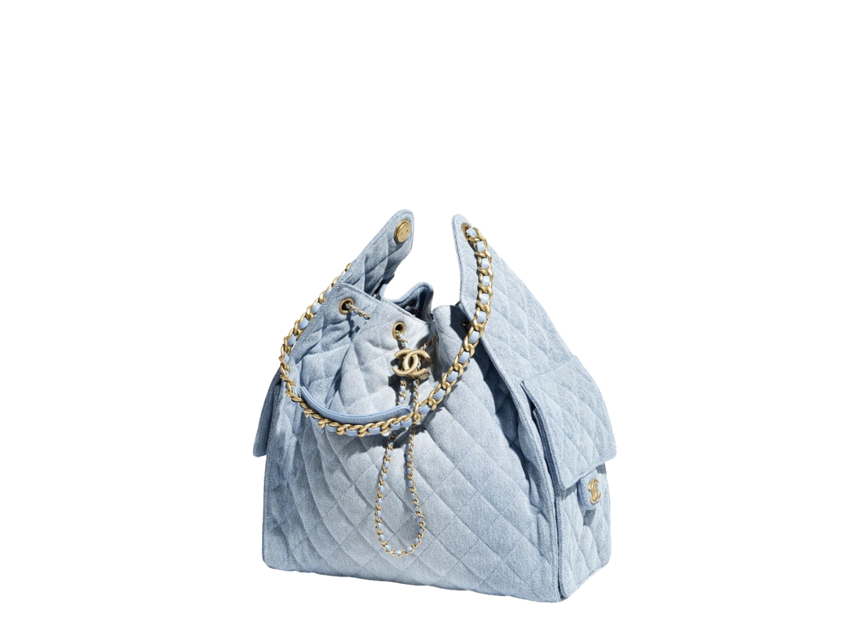 https://d2cva83hdk3bwc.cloudfront.net/AS5311-B20603-U0475-chanel-25-medium-handbag-in-washed-denim-with-gold-hardware-2.jpg