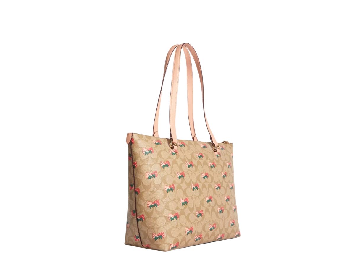 https://d2cva83hdk3bwc.cloudfront.net/CB595-IMOT4-coach-gallery-tote-bag-in-signature-canvas-with-strawberry-print-gold-hardware-light-khaki-multi-2.jpg