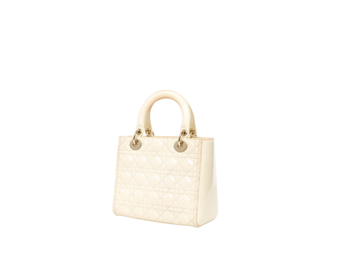 https://d2cva83hdk3bwc.cloudfront.net/DOR-HABBDPCMLDBIGTHWCY46P-dior-patent-cannage-medium-lady-dior-bag-in-gold-tone-hardware-with-cream-3.jpg
