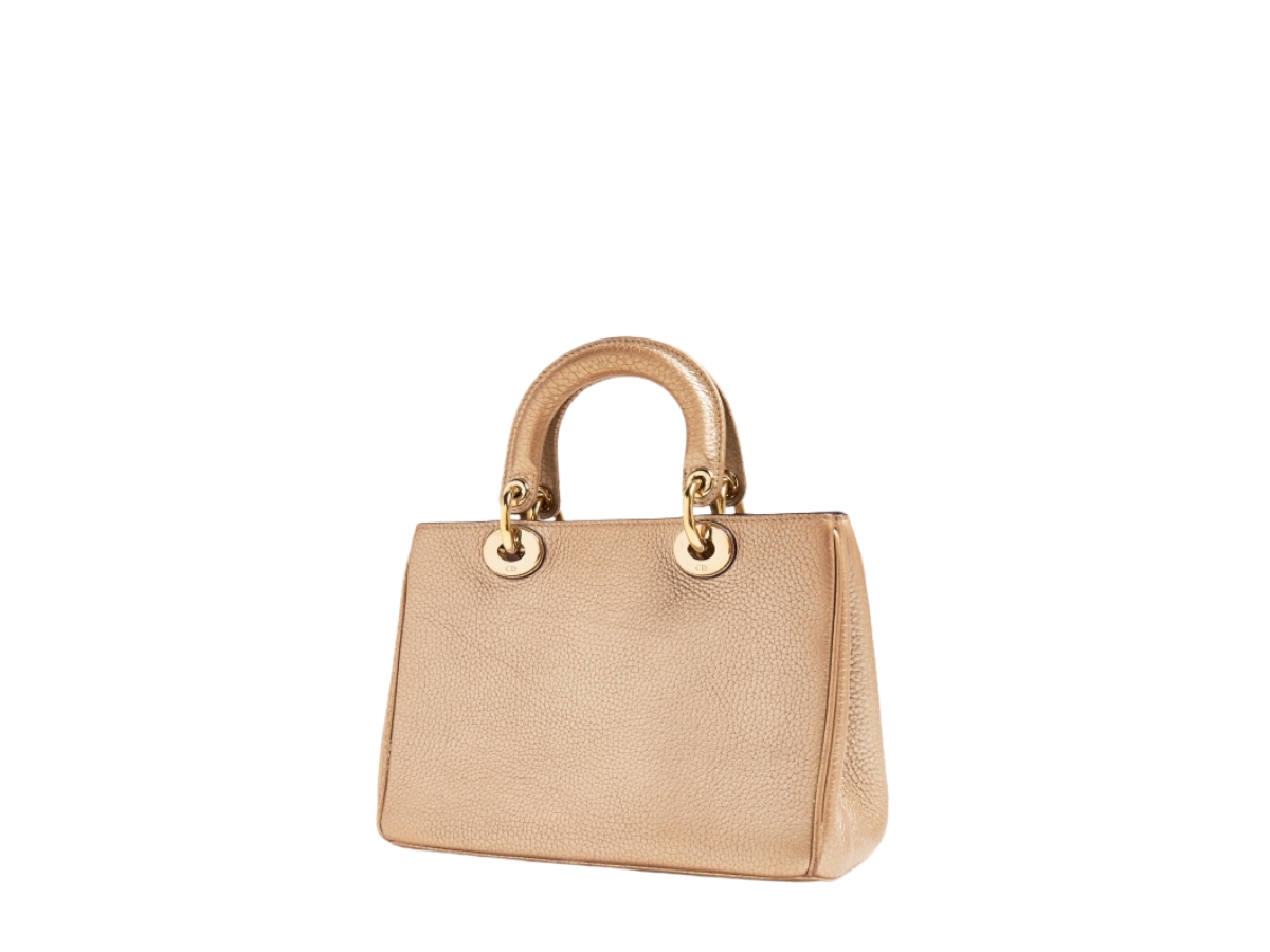 https://d2cva83hdk3bwc.cloudfront.net/DOR-HABBDSDTBIGMLWGHTFT9-dior-small-diorissimo-tote-bag-in-gold-metallic-leather-with-gold-hardware-2.jpg