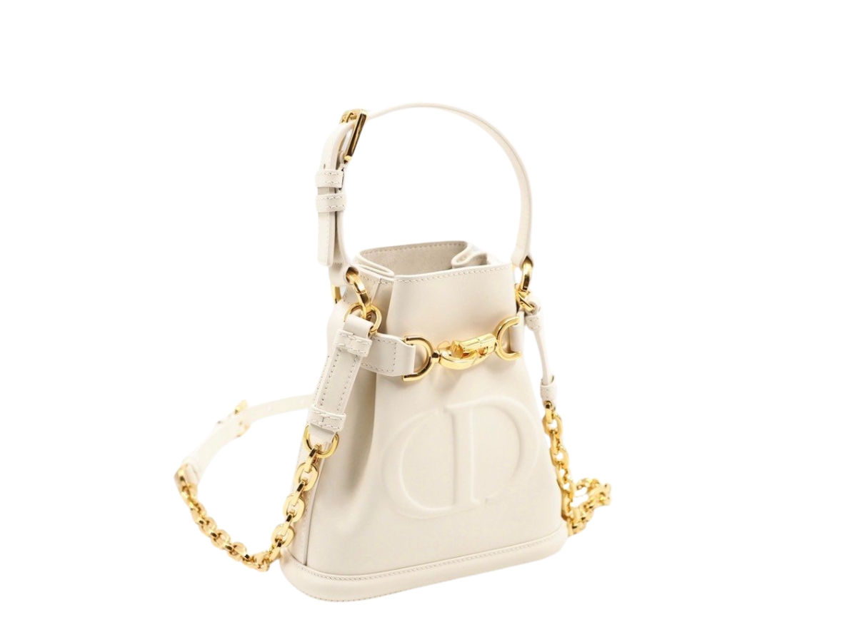 https://d2cva83hdk3bwc.cloudfront.net/DOR-SBBDSCEDBIWCECWCLCGHWHZYP-dior-small-c-est-dior-bag-in-white-cd-embossed-calfskin-with-cd-lock-closure-gold-hardware-white-2.jpg