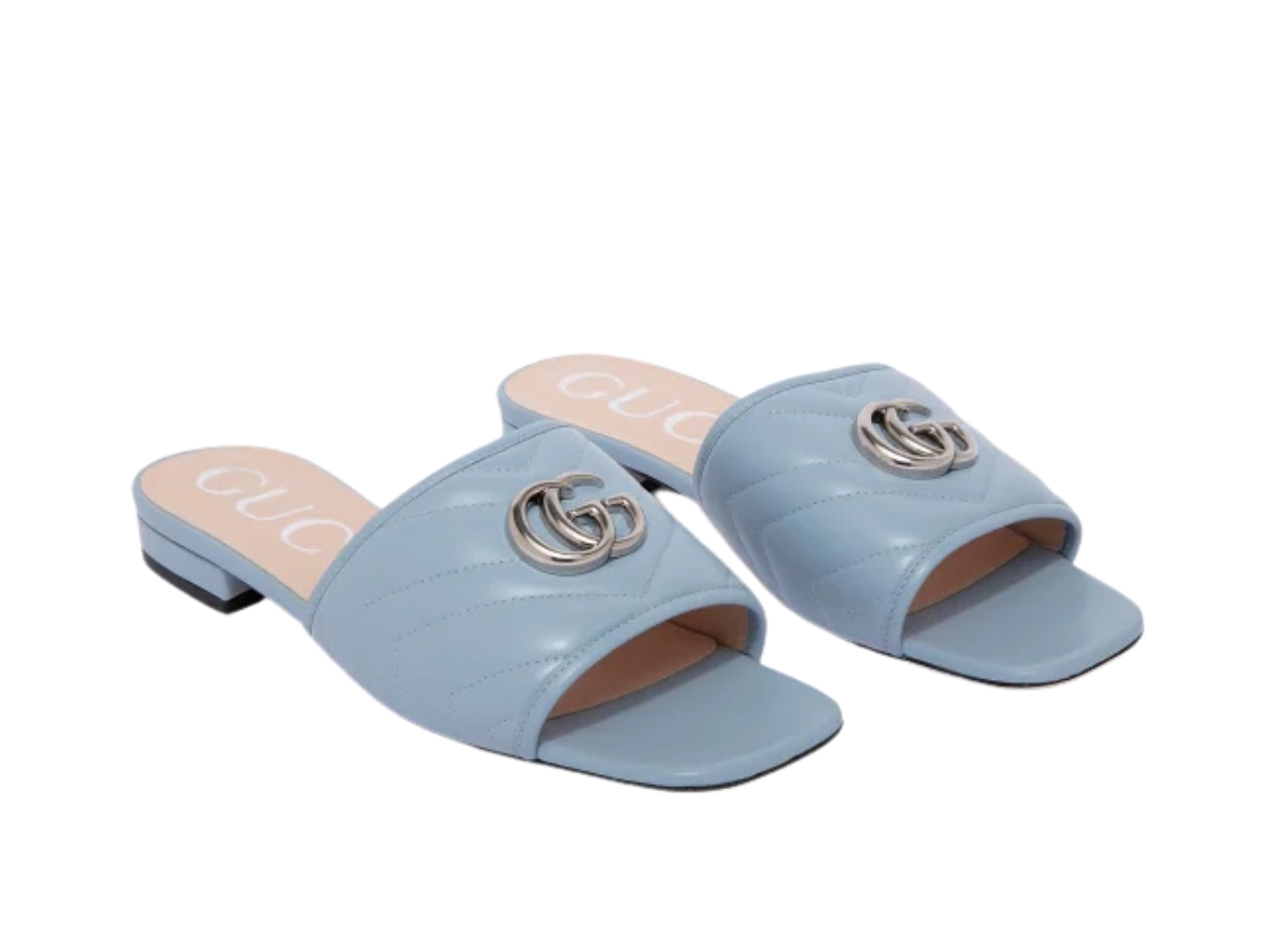 https://d2cva83hdk3bwc.cloudfront.net/GC-SDSGJLSIBQLWSH2J9F-gucci-jolie-logo-slides-in-blue-quilted-leather-with-silver-hardware-2.jpg