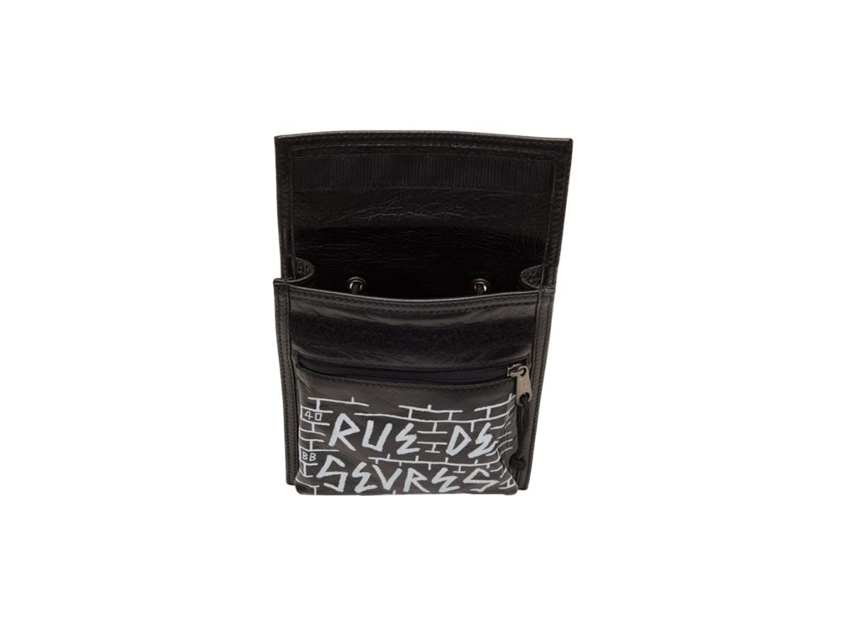 https://d2cva83hdk3bwc.cloudfront.net/balenciaga-explorer-small-pouch-with-strap-in-black-graffiti-all-over-logo-grained-lambskin-4.jpg
