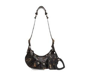Buy Balenciaga Le Cagole XS Shoulder Bag In Lambskin And Charm Detail With Aged-Gold Hardware Black at Sasom – Authentic and Ready to Ship