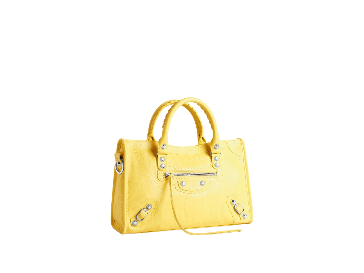 https://d2cva83hdk3bwc.cloudfront.net/balenciaga-le-city-small-bag-in-yellow-arena-lamsbkin-with-shiny-silver-hardware-2.jpg