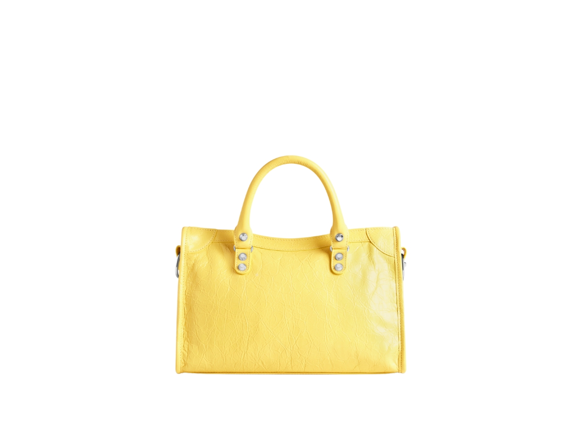 https://d2cva83hdk3bwc.cloudfront.net/balenciaga-le-city-small-bag-in-yellow-arena-lamsbkin-with-shiny-silver-hardware-4.jpg