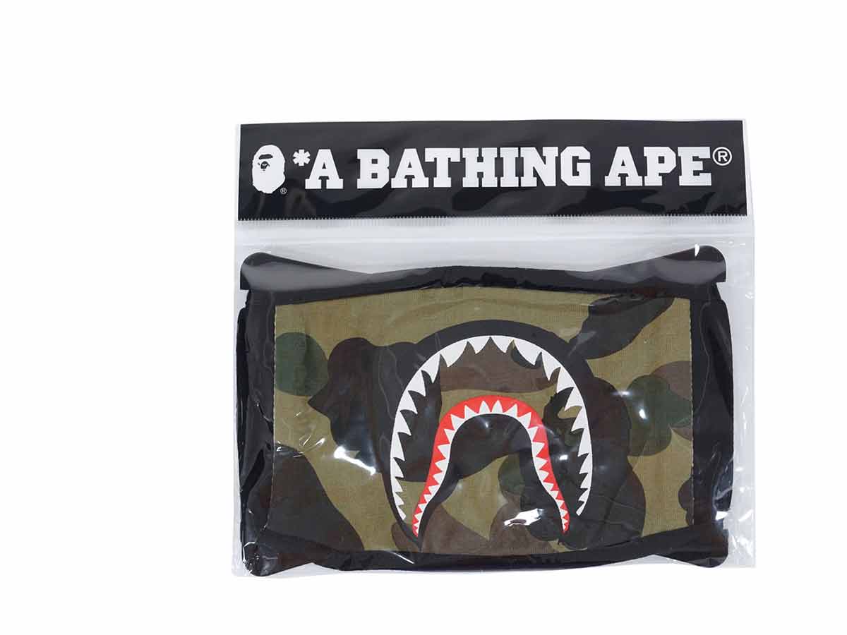 https://d2cva83hdk3bwc.cloudfront.net/bape-1st-camo-shark-face-mask-green-1.jpg