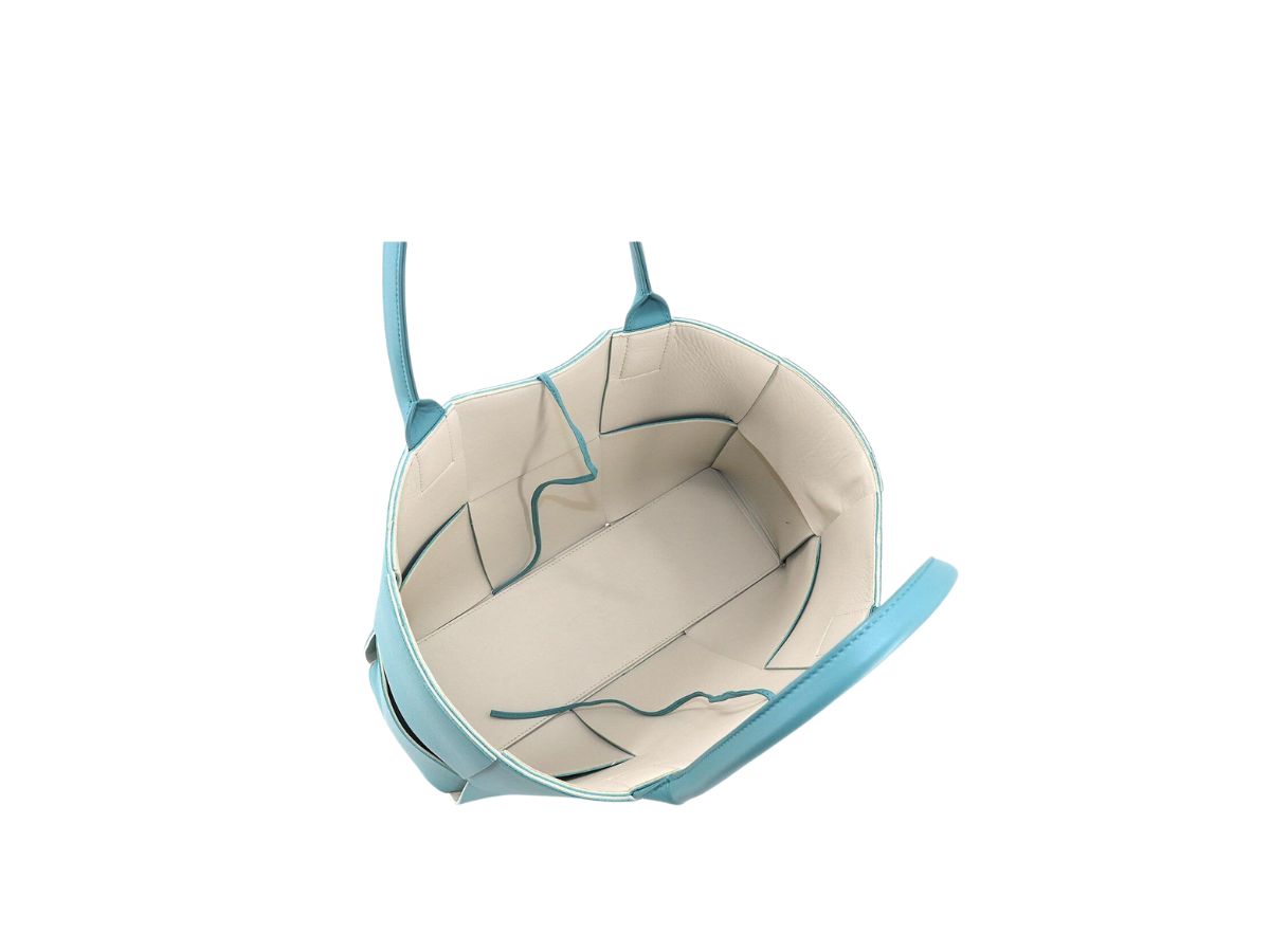 https://d2cva83hdk3bwc.cloudfront.net/bottega-veneta-arco-tote-bag-in-medium-intrecciato-canvas-light-blue-2.jpg