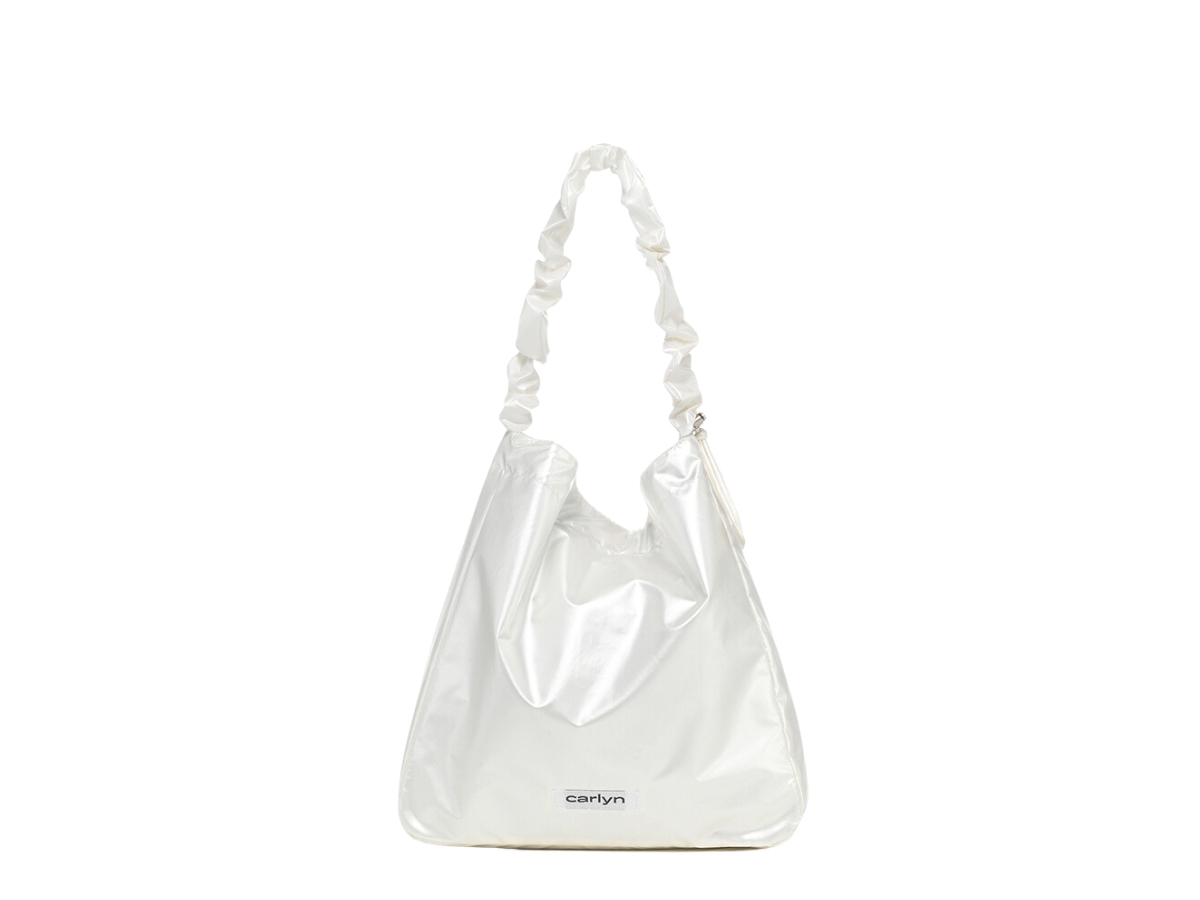 https://d2cva83hdk3bwc.cloudfront.net/carlyn-russ-ecobag-in-polyester-pu-with-silver-hardware-pearl-white-3.jpg