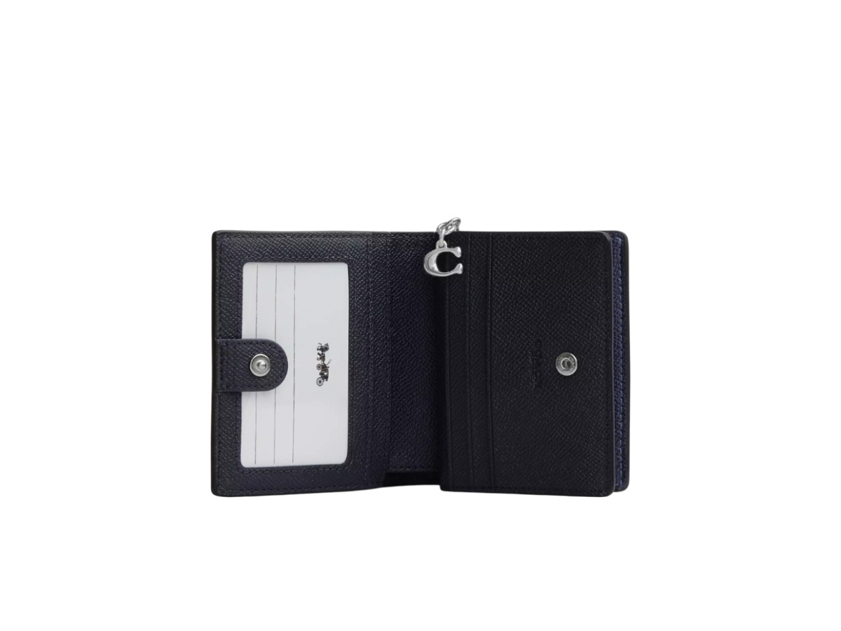 https://d2cva83hdk3bwc.cloudfront.net/ccl96-sblnv-coach-snap-wallet-in-signature-canvas-blue-navy-2.jpg