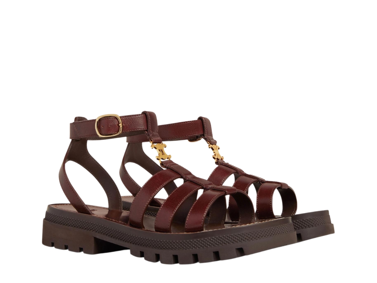 https://d2cva83hdk3bwc.cloudfront.net/celine-clea-triomphe-gladiator-chunky-sandal-in-calfskin-vegetal-tanning-with-triomphe-gold-hardware-dark-brown-2.jpg