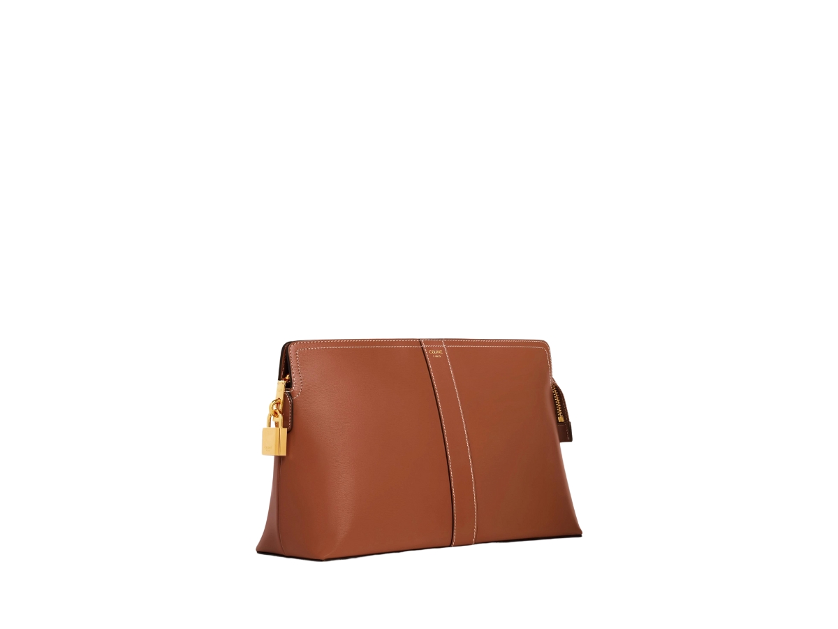 https://d2cva83hdk3bwc.cloudfront.net/celine-lock-toiletry-pouch-in-shiny-calfskin-with-gold-finishing-hardware-tan-3.jpg