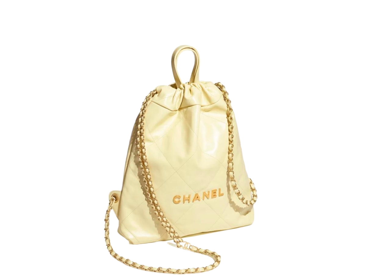 https://d2cva83hdk3bwc.cloudfront.net/chanel-22-backpack-in-shiny-calfskin-with-gold-tone-metal-light-yellow-2.jpg