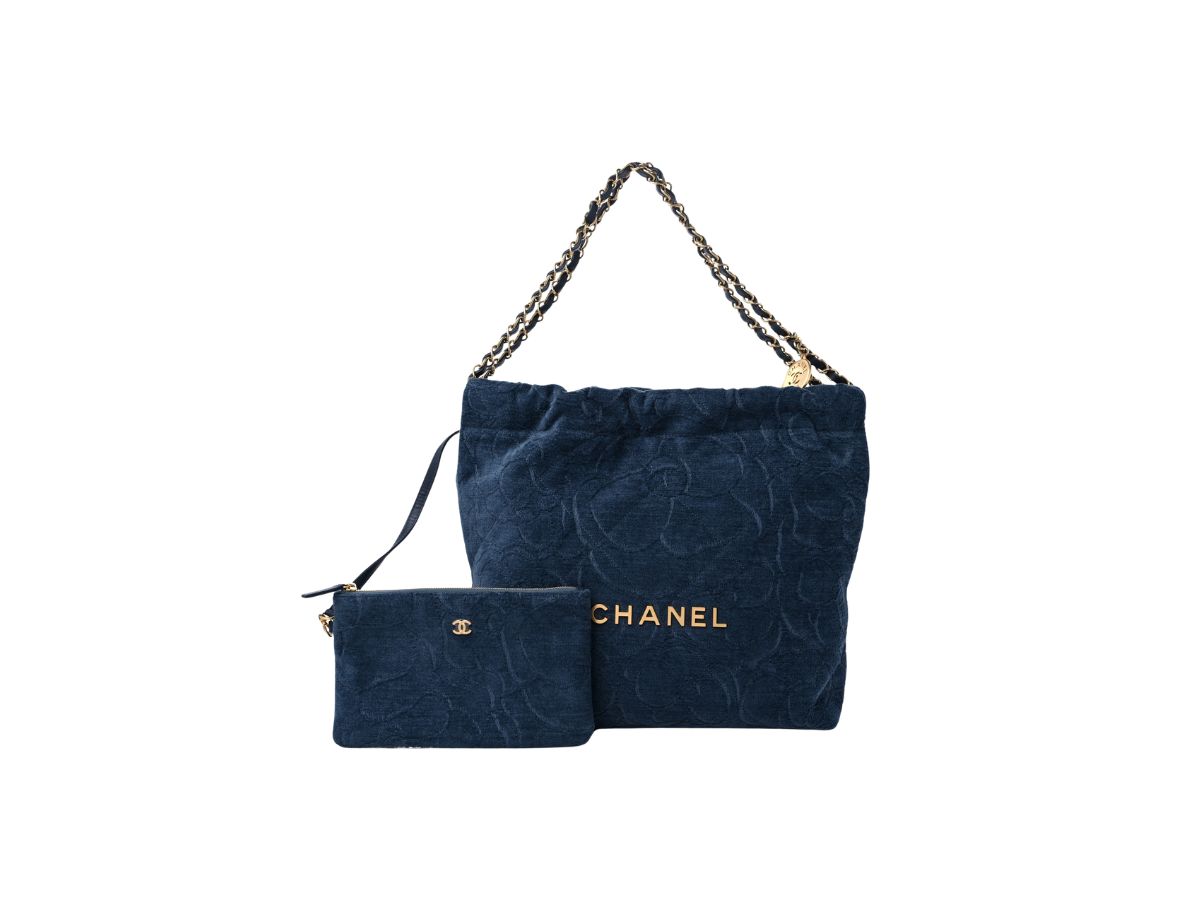 https://d2cva83hdk3bwc.cloudfront.net/chanel-22-small-handbag-in-velvet-camellia-with-gold-tone-metal-dark-blue-1.jpg