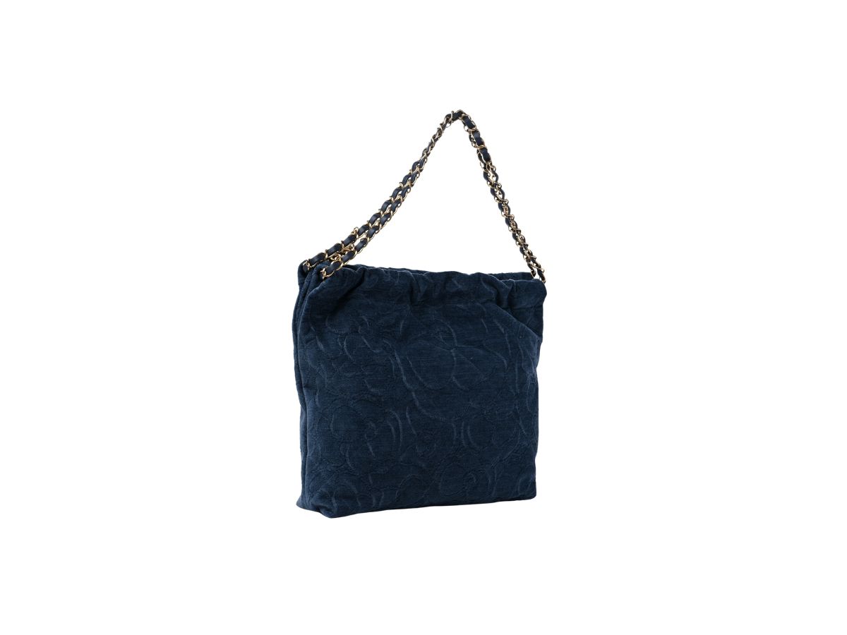 https://d2cva83hdk3bwc.cloudfront.net/chanel-22-small-handbag-in-velvet-camellia-with-gold-tone-metal-dark-blue-3.jpg