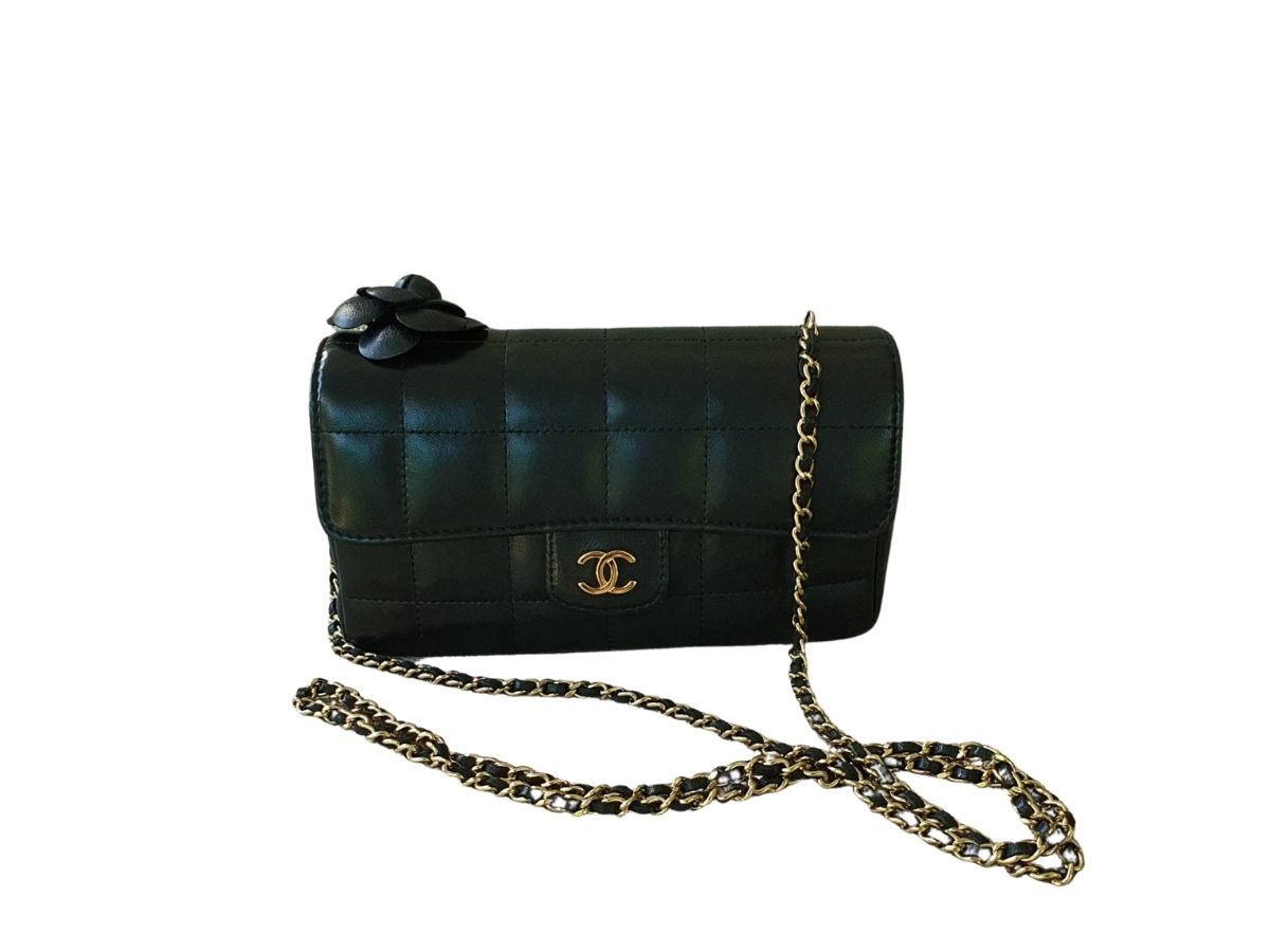 https://d2cva83hdk3bwc.cloudfront.net/chanel-black-chocolate-bar-leather-camellia-mini-flap-bag-1.jpg