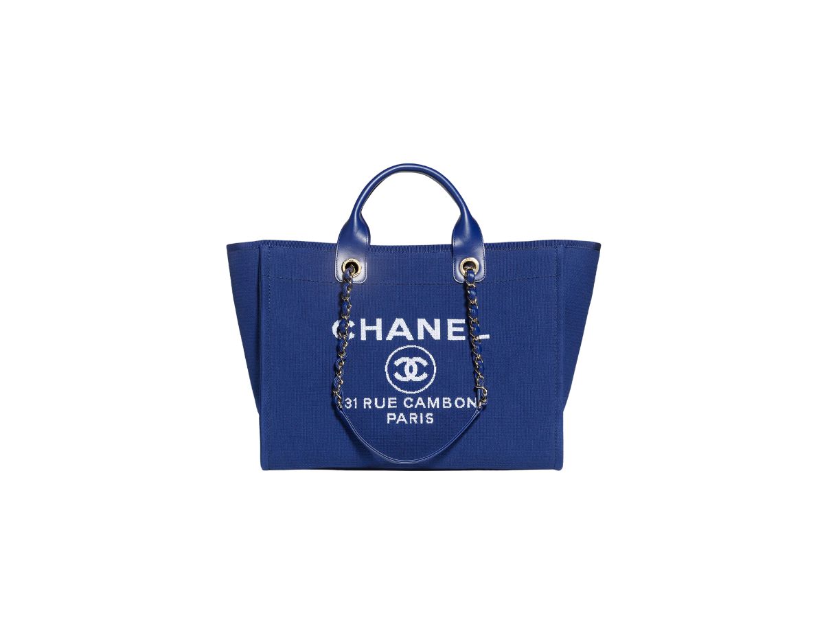 https://d2cva83hdk3bwc.cloudfront.net/chanel-large-tote-in-mixed-fibres-and-calfskin-with-gold-tone-metal-blue-1.jpg
