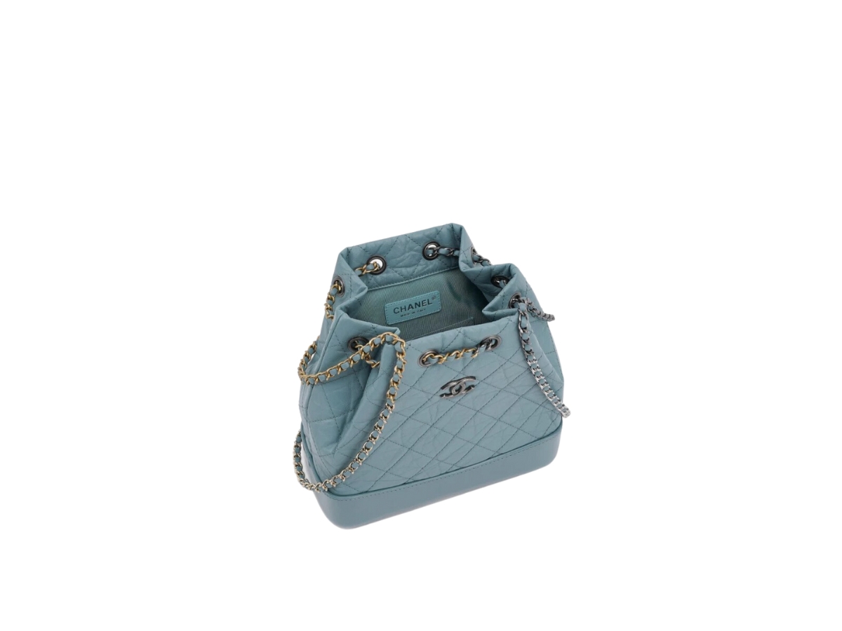 https://d2cva83hdk3bwc.cloudfront.net/chanel-small-gabrielle-backpack-in-aged-calfskin-with-gold-silver-metal-hardware-blue-3.jpg