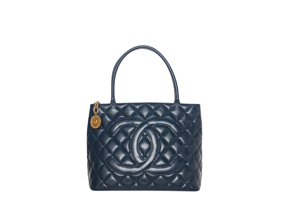 https://d2cva83hdk3bwc.cloudfront.net/chanel-vintage-chanel-navy-blue-caviar-quilted-medallion-tote-1.jpg