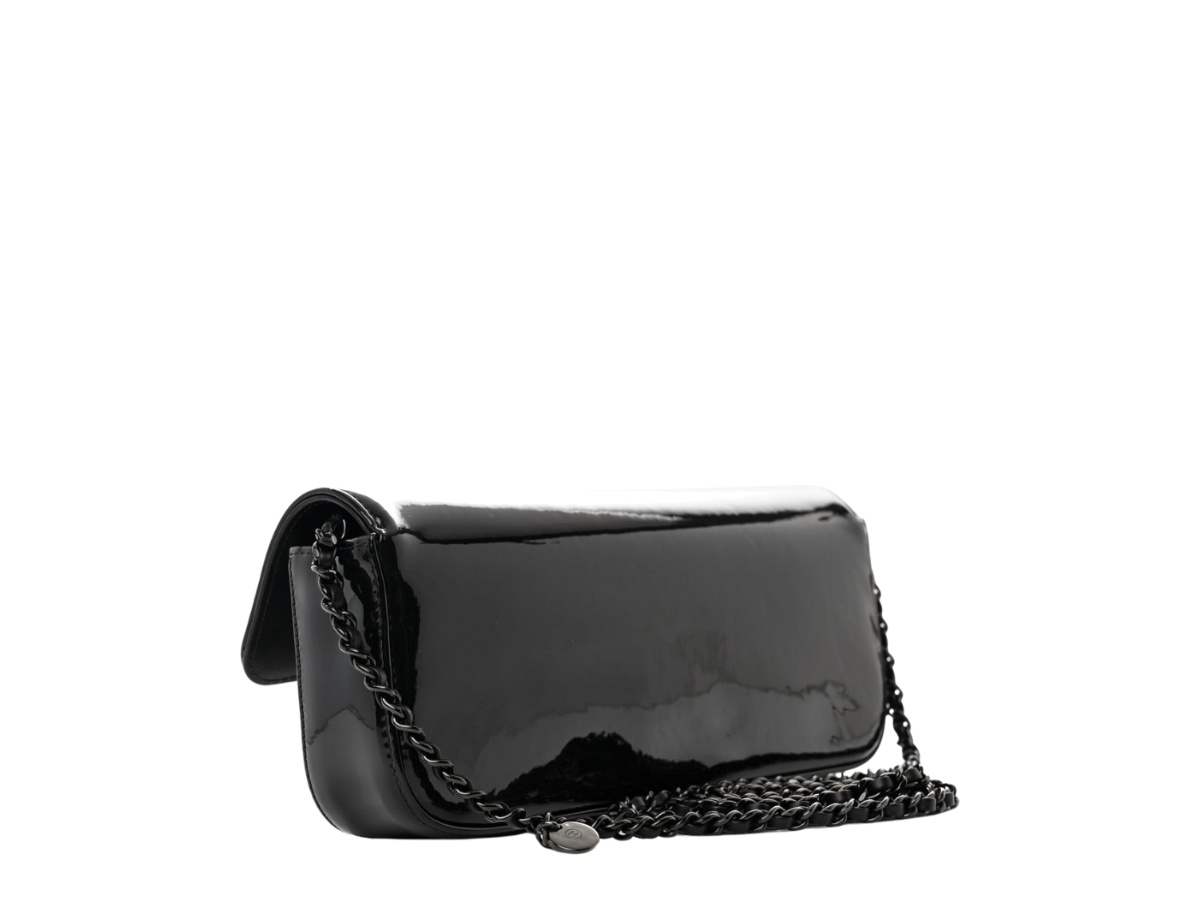 https://d2cva83hdk3bwc.cloudfront.net/chl-sbbccewfibpcwbmhsb-chanel-camellia-e-w-flap-in-black-patent-calfskin-with-black-metal-hardware-so-black-3.jpg