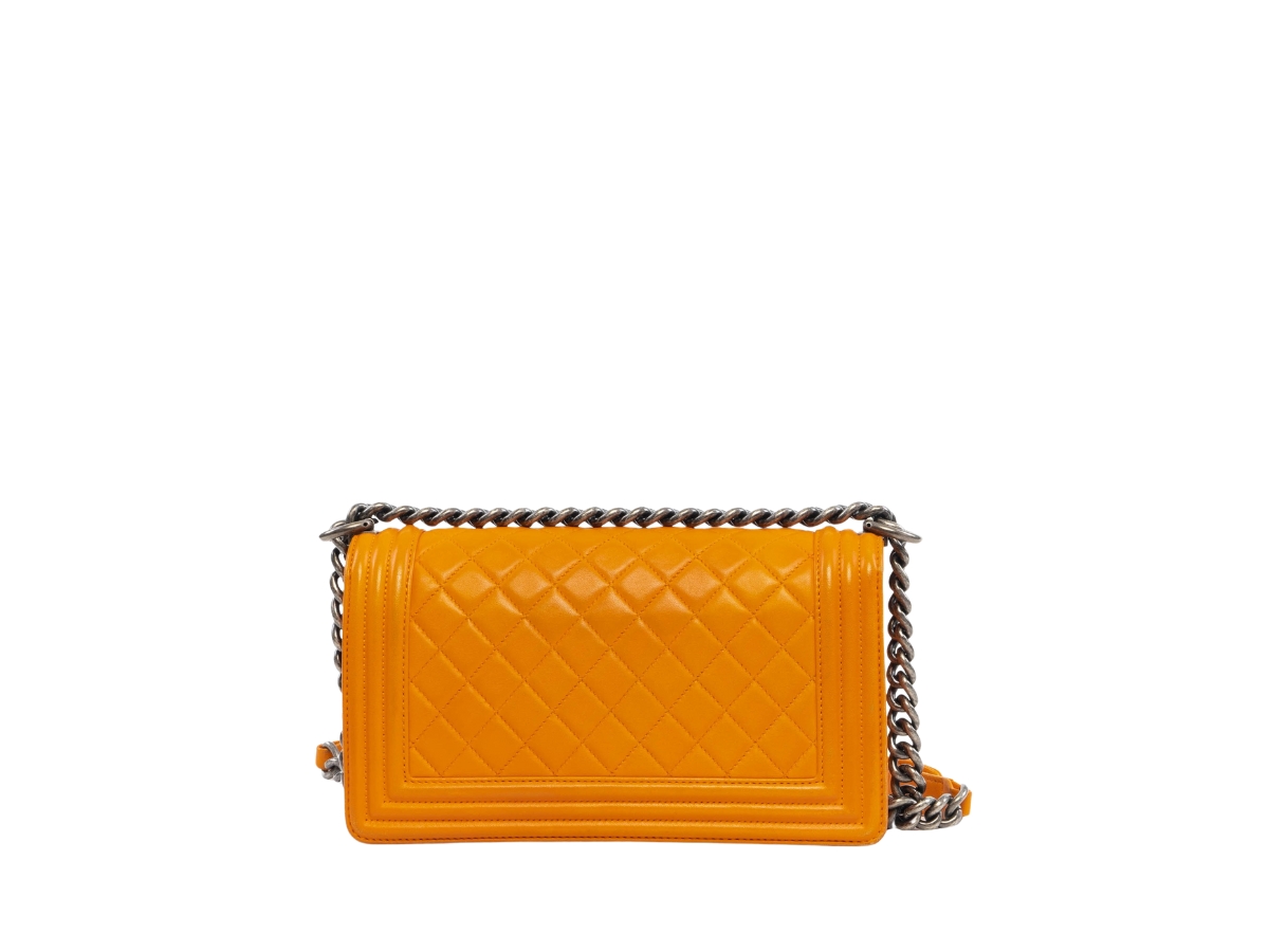 https://d2cva83hdk3bwc.cloudfront.net/chl-sbbcmbbighwo-chanel-medium-boy-bag-in-gold-hardware-with-orange-2.jpg