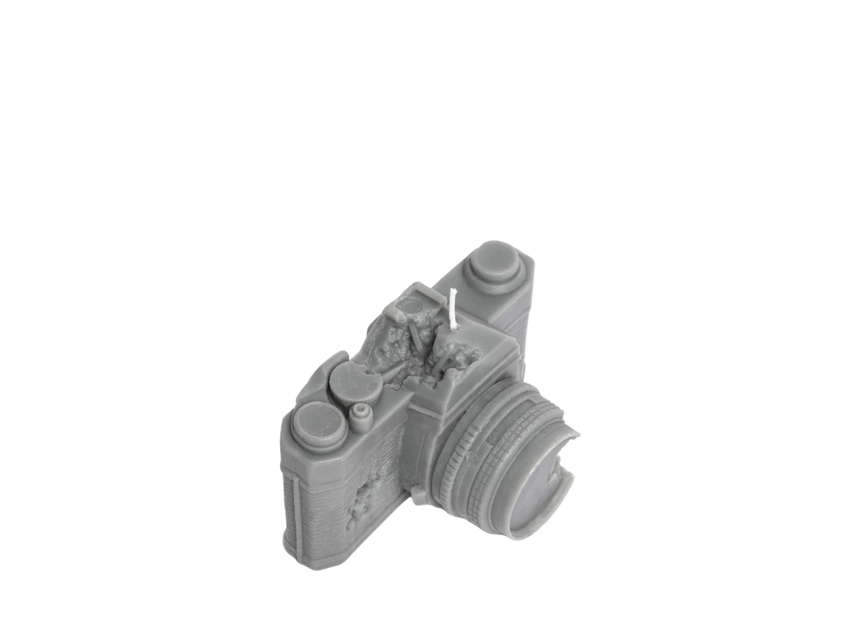 https://d2cva83hdk3bwc.cloudfront.net/daniel-arsham-eroded-camera-candle-grey-3.jpg