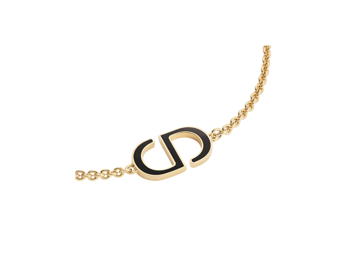 https://d2cva83hdk3bwc.cloudfront.net/dior-petit-cd-bracelet-in-cd-signature-gold-finish-metal-and-black-lacquer-2.jpg