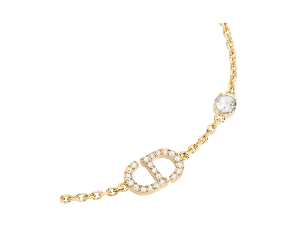 https://d2cva83hdk3bwc.cloudfront.net/dior-petit-cd-bracelet-in-cd-signature-gold-finish-metal-and-silver-tone-crystals-2.jpg